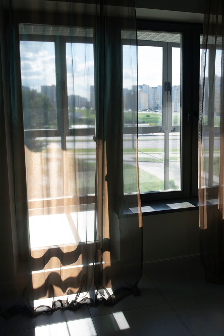 view-window-with-textile-curtains-shadows_23-2149657466